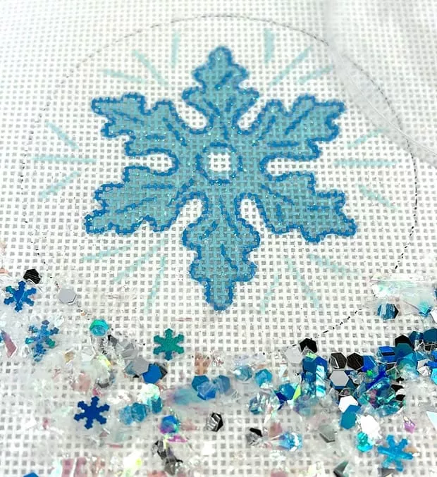Kate Dickerson Needlepoint – Christmas Ornament w/Clear Dome & Confetti – Snowflake