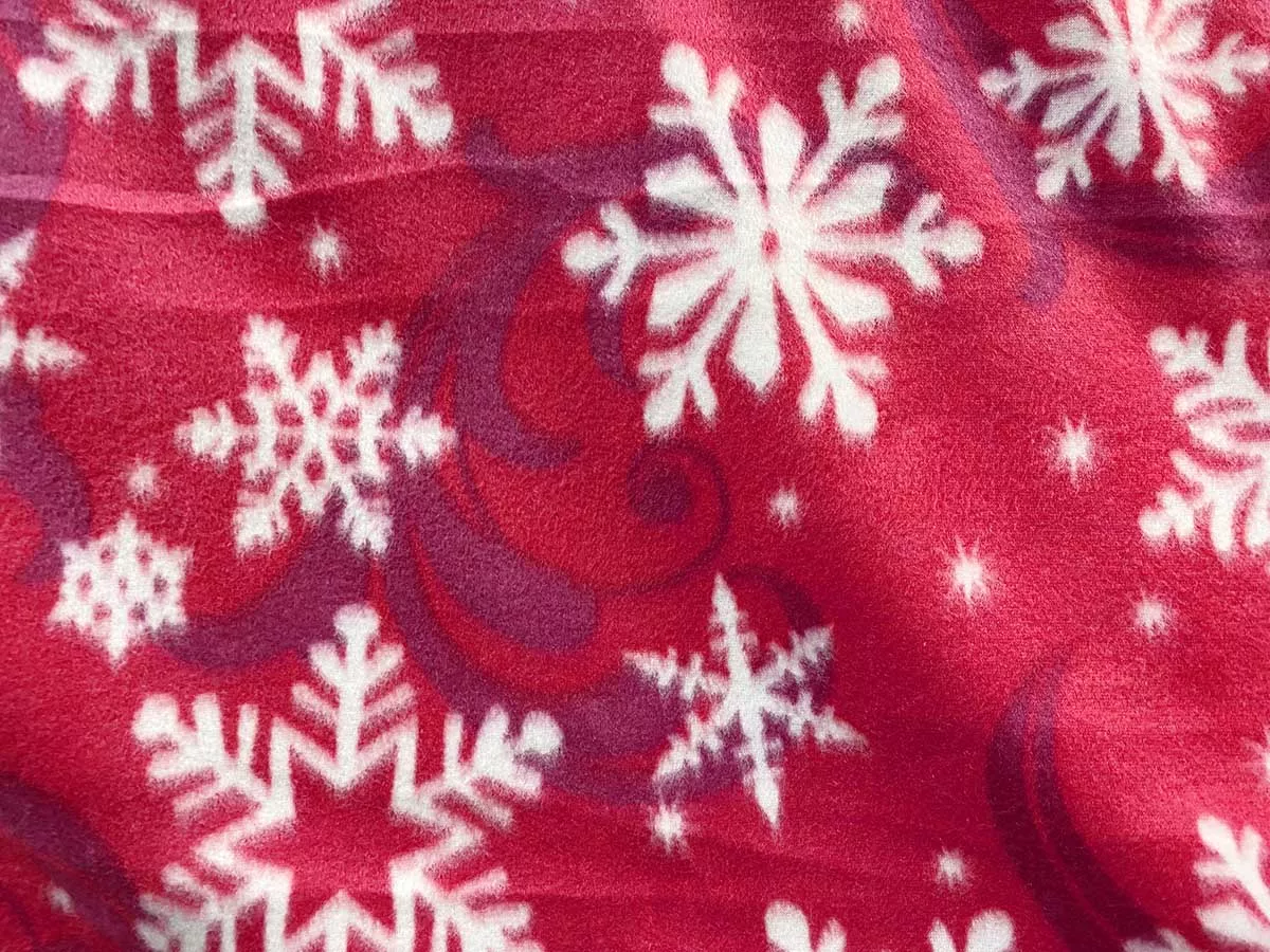Polar Fleece Print Fabric - Snowflakes on Red